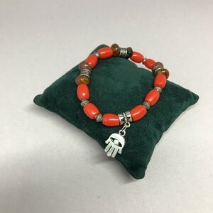 Hamsa bracelet with coral colored beads. New, with Fatima hand charm.